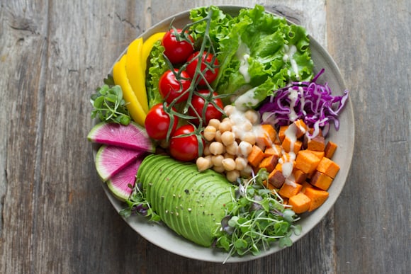 Grain bowl with roasted vegetables and greens